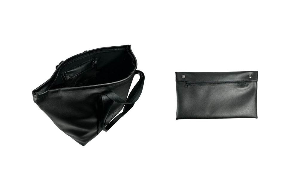 flat lay on a white background showing the inside of a black vegan leather weekender bag (left) and a detachable pouch of the same material (right)
