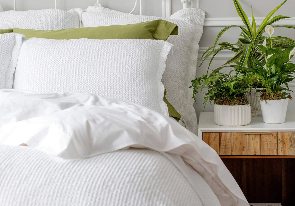 beautiful st geneve bedding layered on a bed