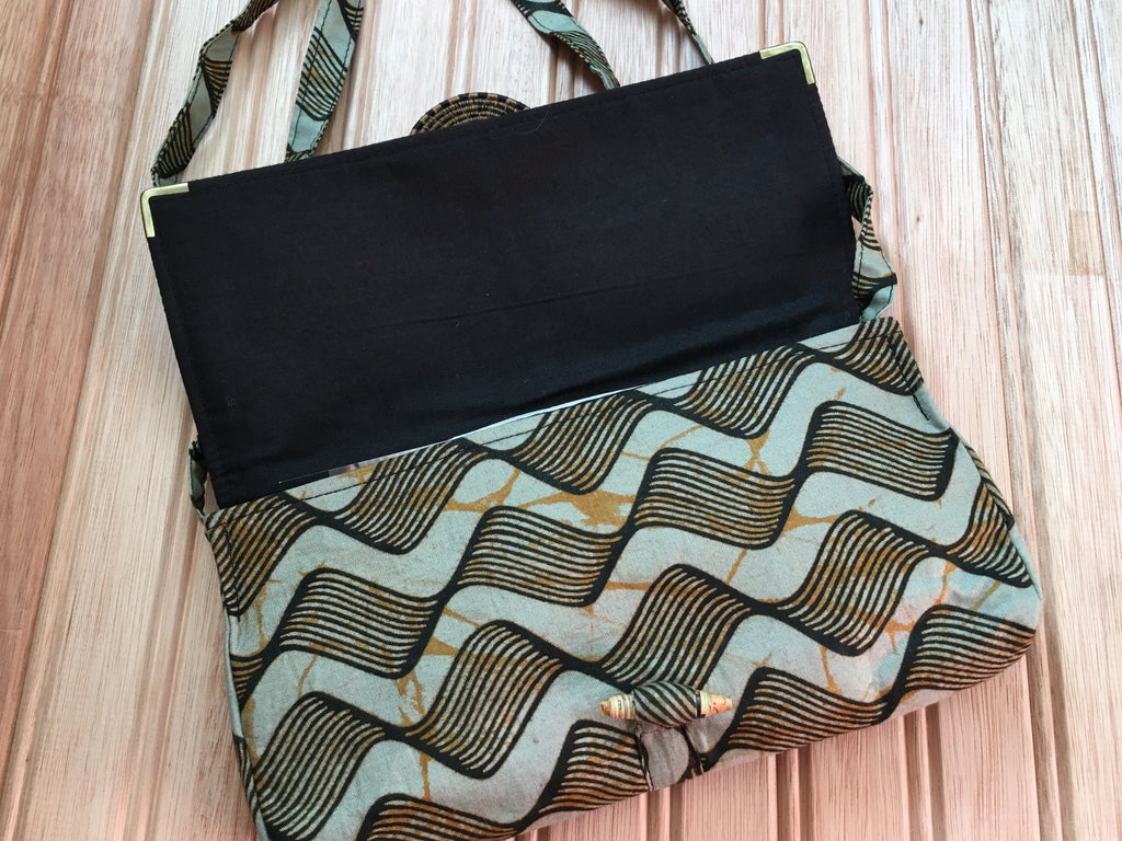 clutch bag with shoulder strap