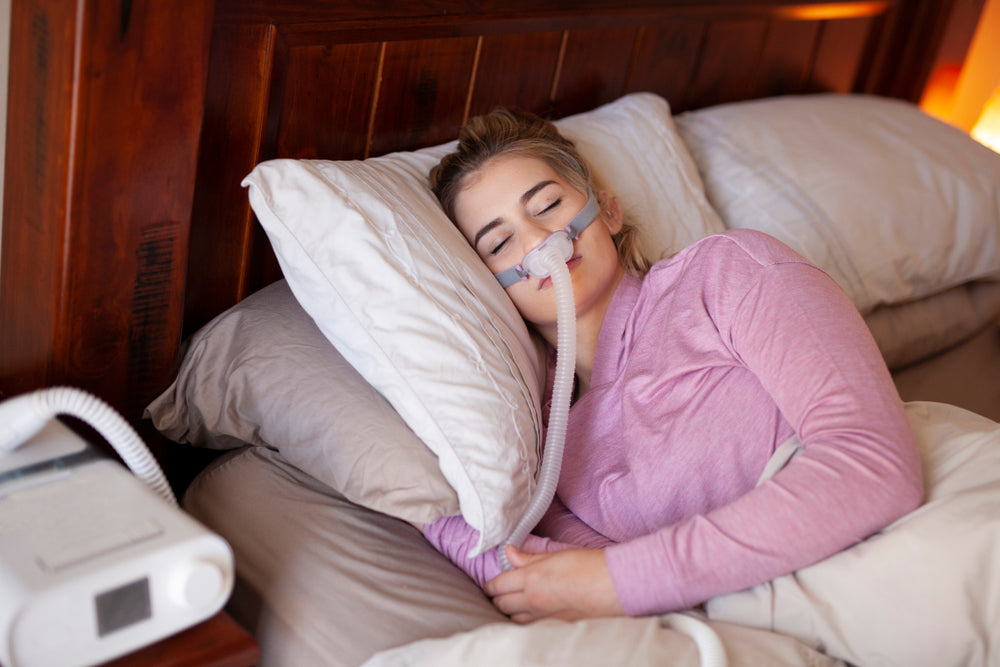 Woman sleeping using a CPAP Machine - NSW CPAP