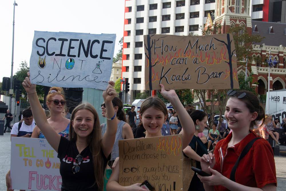 Girls at Climate Change Protest March holding placards