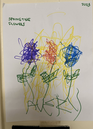 A child's drawing of three flowers in different colours.