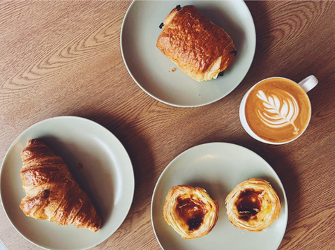 Gaia Coffee Flat white with a selection of pastries