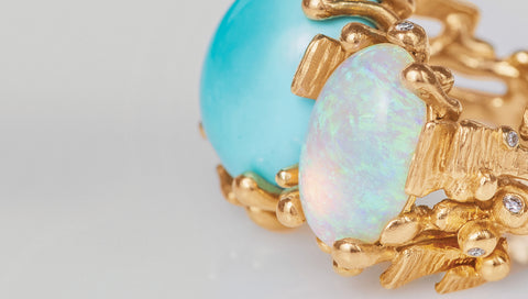 image of opal and turquoise ring in boho style set in 18ct yellow gold with diamonds