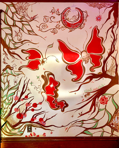 mural featuring butterflies and woodland insect critters in brown, red and pink.