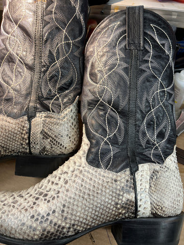 A pair of snake boots laying on their side