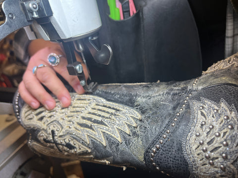 A boot being stitched together