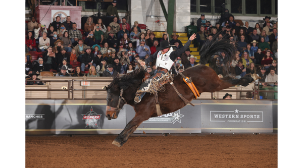 Kody Rinehart, professional saddle bronc rider and pro staff team member of Fairhope Roughstock Co riding a sadlle bronc horse in a rodeo.