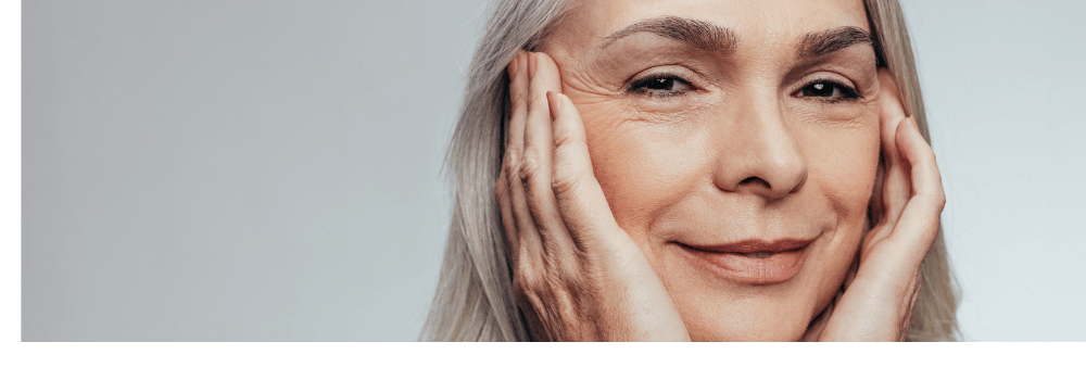 A women with grey hair smiling