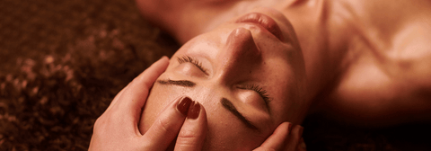 A woman getting a face massage