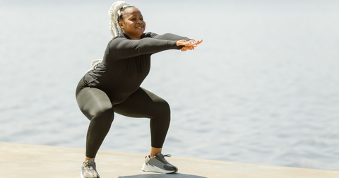 Black woman doing squats | Jenny Nordic Skincare
