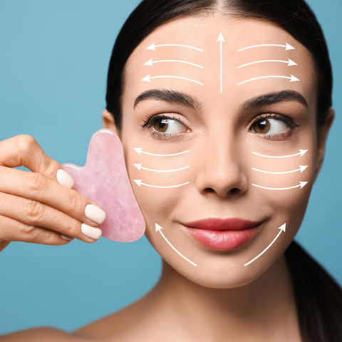 A woman practicing gua sha with a rose squarz tool | Jenny Nordic SKincare