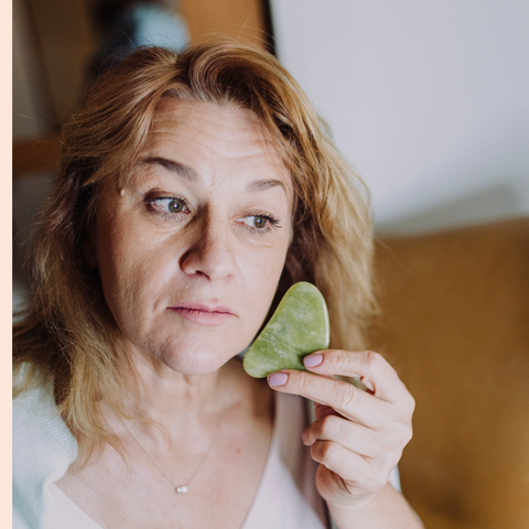 Jenny Nordic skincare | A woman practicing gua sha