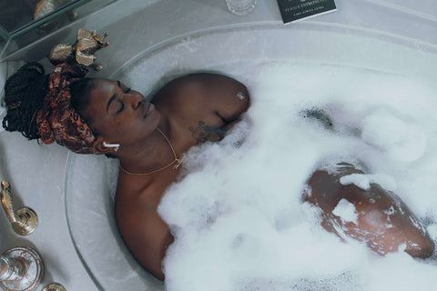 A black woman taking a bath | Jenny Nordic Skincare