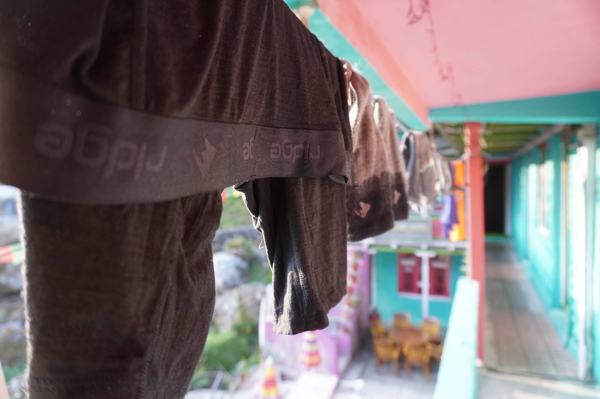 Ridge Merino underwear hanging on a clothes line after being hand-washed after being worn traveling