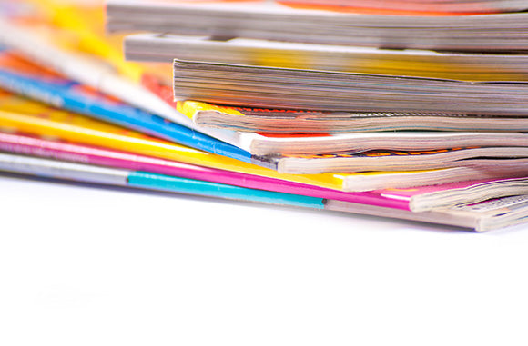 a stack of colorful magazines