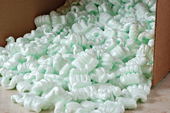 a box of packing peanuts spilling onto a floor