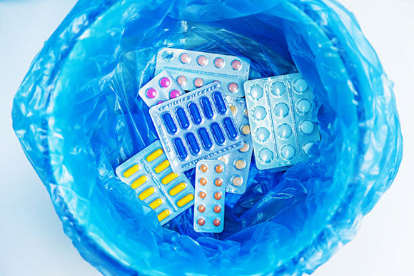 pill packets in bin