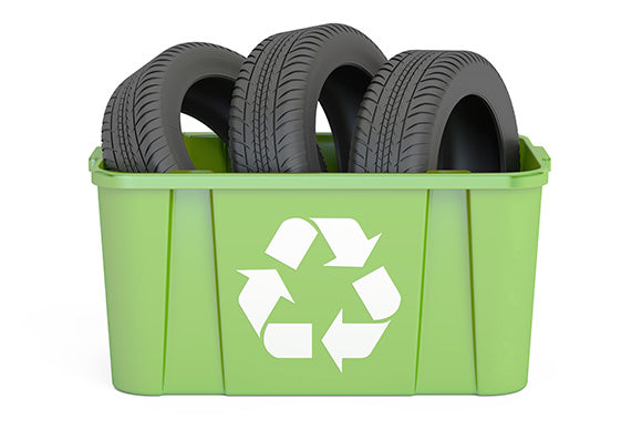 a recycling bin with tires