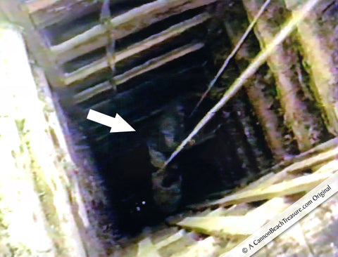 Robert Lewis Knecht going first into a 120 foot deep and pitch black moonstine mine in Sri Lanka