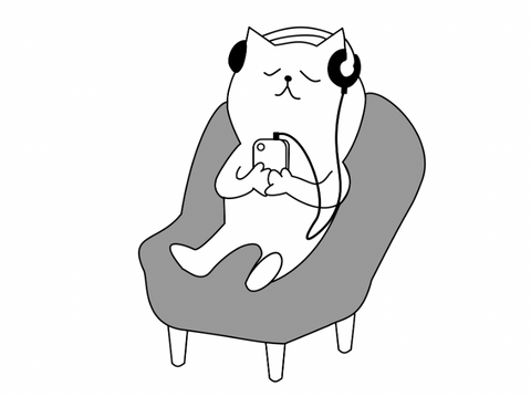 Cat relaxing in chair, listening to music