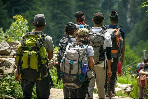 A group of hikers wearing rucksacks