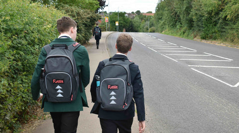 Teens wearing Futliit LED backpacks