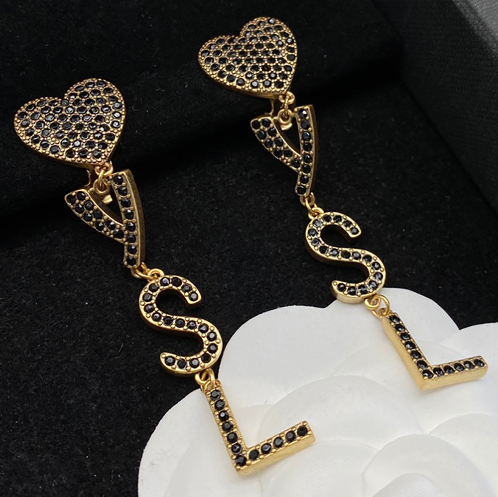 YSL Yves Saint Laurent monogram logo earrings with diamonds