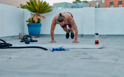 In this dynamic image, we witness a man energetically performing burpees, showcasing the determination and full-body engagement required for this challenging exercise.  Burpees are a high-intensity, full-body workout that combines strength, cardiovascular fitness, and agility. This exercise can be performed virtually anywhere and requires no special equipment, making it accessible to individuals of various fitness levels.  Whether you're looking for a calorie-burning exercise, a way to increase strength and endurance, or a challenging addition to your workout routine, burpees offer a versatile and impactful choice. They embody the essence of demanding and rewarding fitness.  So, join in the intensity, embrace the challenge, and experience the strength and conditioning benefits that come from burpees. It's a reminder that fitness can be both demanding and accessible to all.