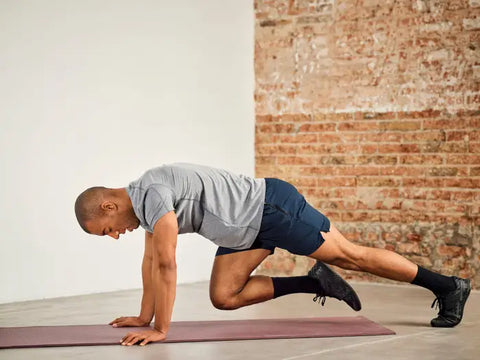 In this intense image, we witness a man energetically performing mountain climbers, demonstrating the full-body engagement and endurance required for this challenging exercise.  Mountain climbers are a dynamic full-body workout that targets multiple muscle groups while also elevating the heart rate. This exercise can be performed virtually anywhere and requires no special equipment, making it accessible to individuals of various fitness levels.  Whether you're seeking a high-intensity workout, a core-strengthening exercise, or a way to improve overall endurance, mountain climbers offer a versatile and effective choice. They embody the essence of challenging and impactful fitness.  So, join in the intensity, embrace the rhythm, and experience the strength and endurance gains that come from mountain climbers. It's a reminder that fitness can be both demanding and accessible to all.