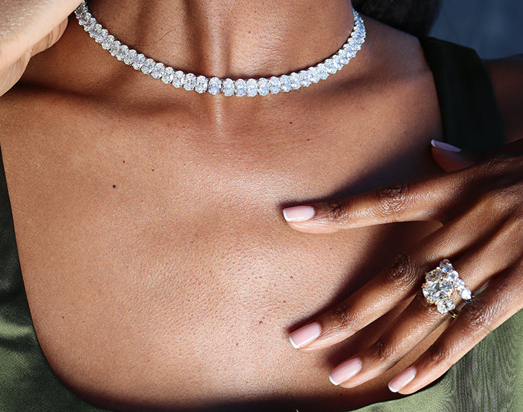 Model wearing lab diamond necklace, engagement ring, and eternity band from Jean Dousset