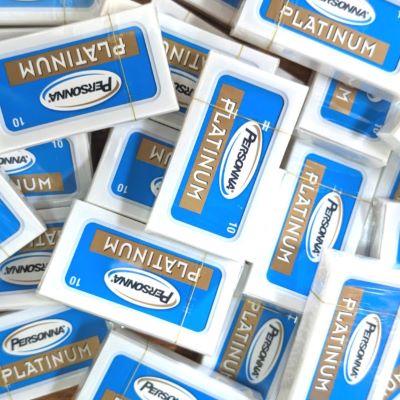 a pile of Personna razor blade packets