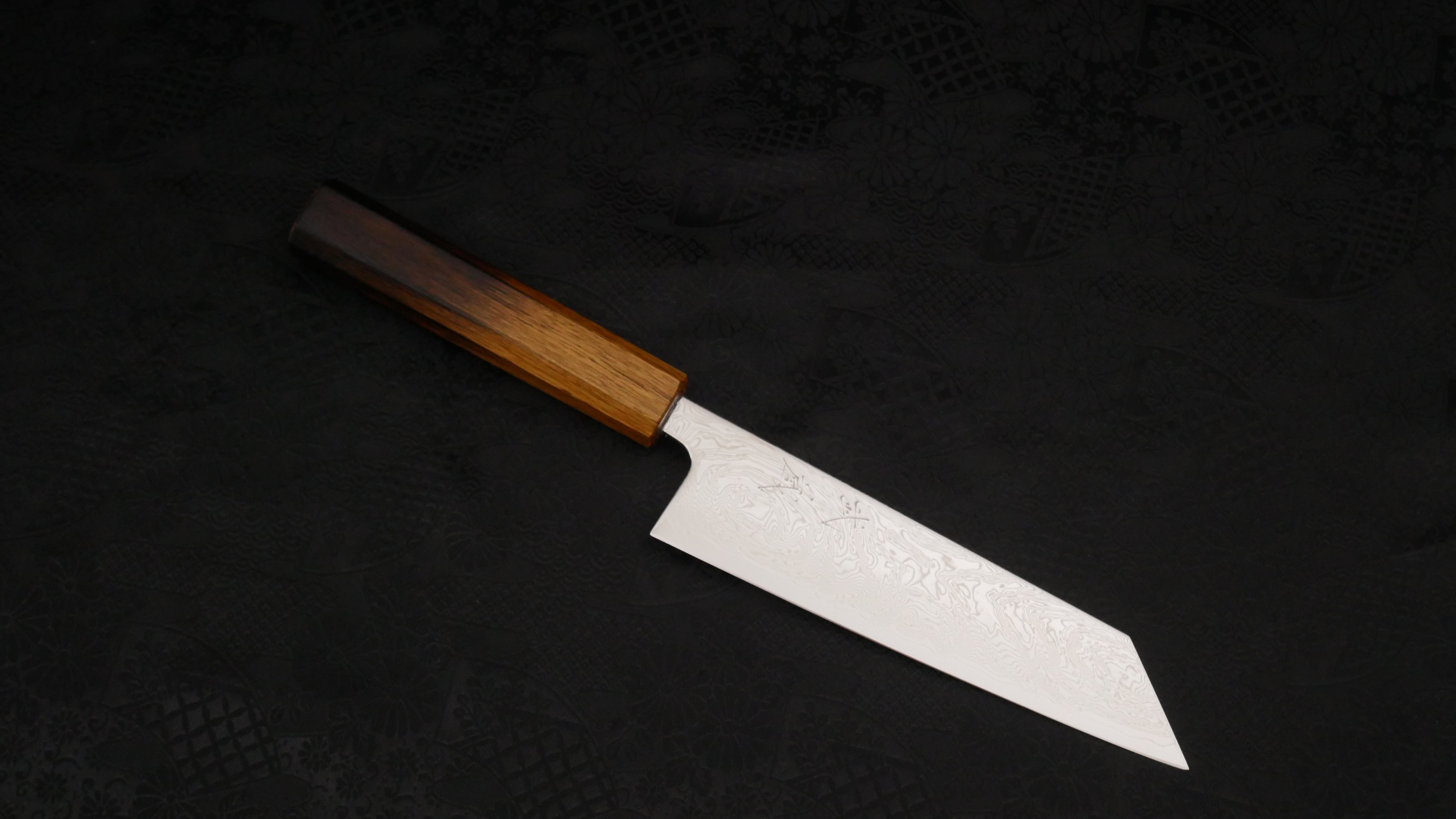 The Bunka knife against a dark background.