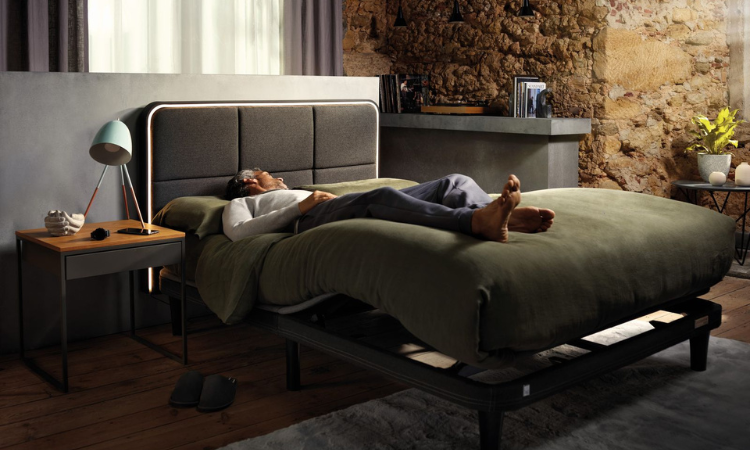 Man sleeping with legs elevated in the ErgoSportive bed