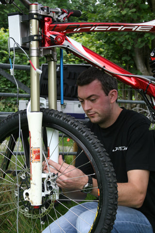 Jim working on a bikes suspension, photo taken in the early 2000s