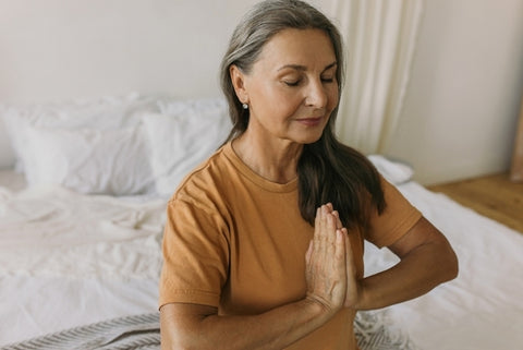 Woman In Yoga Pose Doing Breathing Techniques For Sleep