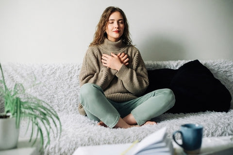 Lady Practising Breathing Techniques For Sleep