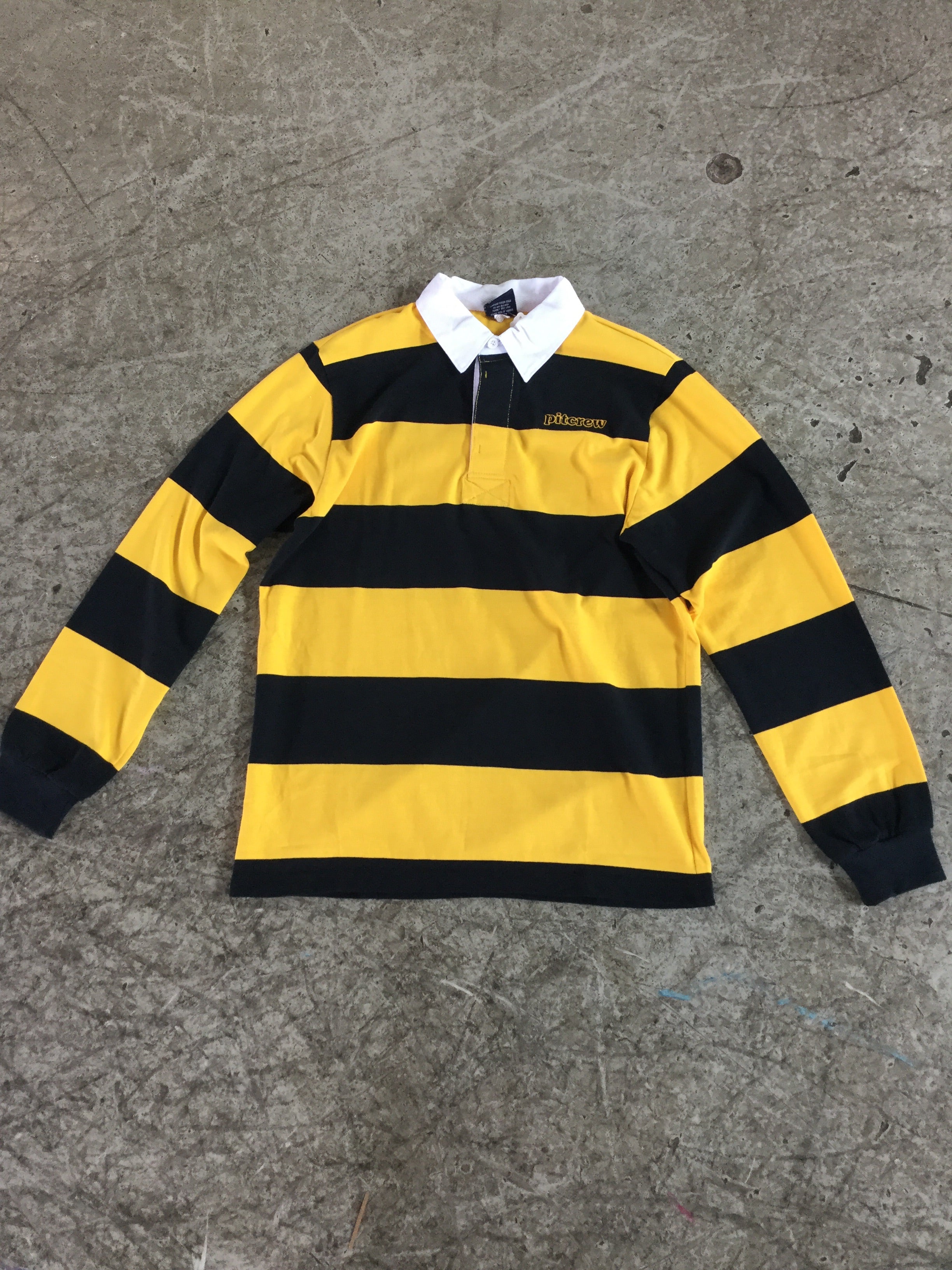 yellow and black rugby shirt