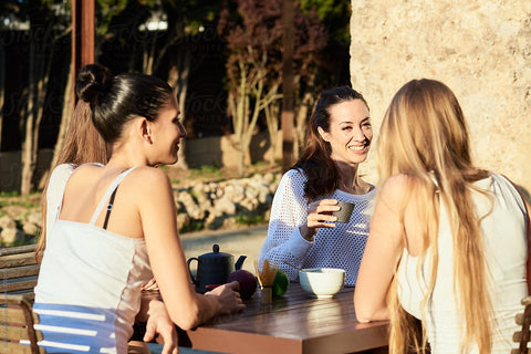 essentially loved quilt self care blog post girlfriends enjoying tea outside