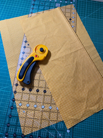 Two cut strips of fabric, one at 6" and one at 14"