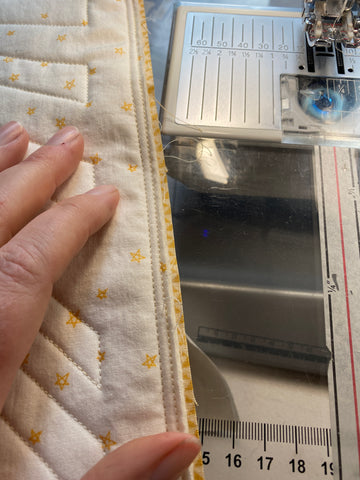 Checking my finished 1/4" seam after sewing around the pillow cover.