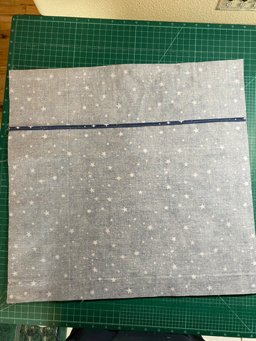 Envelope backing covering pillow face, right sides together.