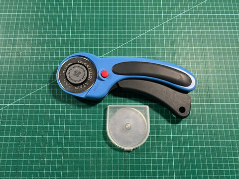 Olfa Rotary Cutter in blue and replacement blades