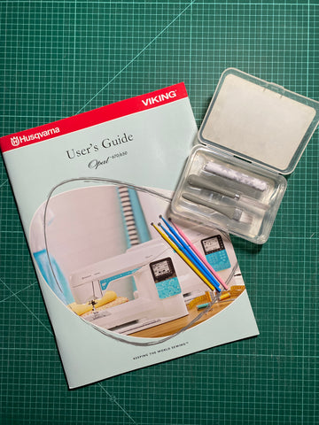 Essentially Loved Quilts Sewing Machine Care and Maintenance blog post with sewing machine manual and cleaning kit