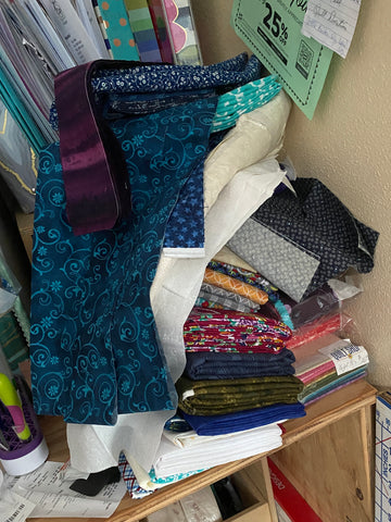 Essentially Loved Quilts stack of fabric scraps