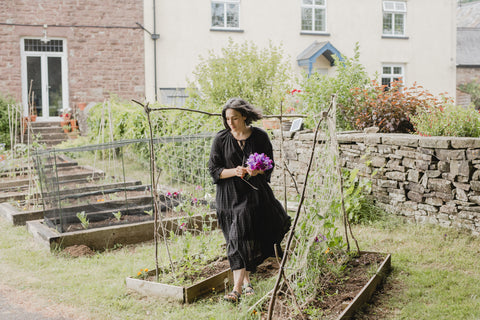 Roanna picks sweetpeas from the cut flower beds