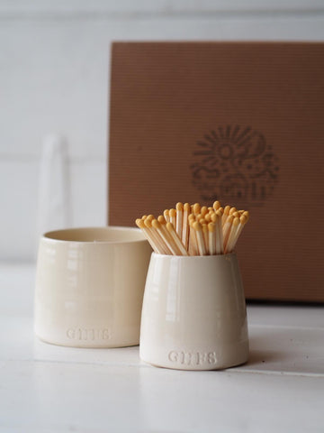 Stone coloured ceramic match pot and candle