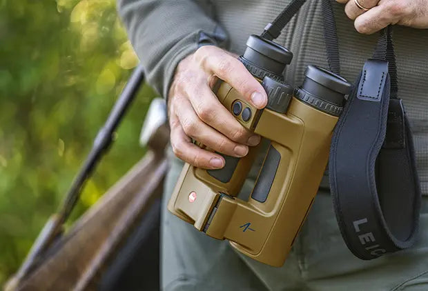 A hunter holds Leica Geovid Pro 10x42 AB+