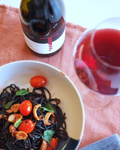 finished spaghetti with pinot on table
