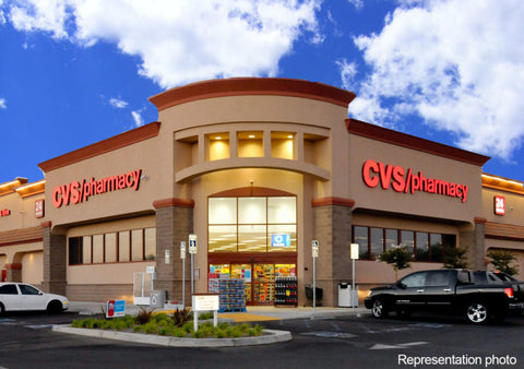 CVS store with parking lot against a blue sky with white clouds